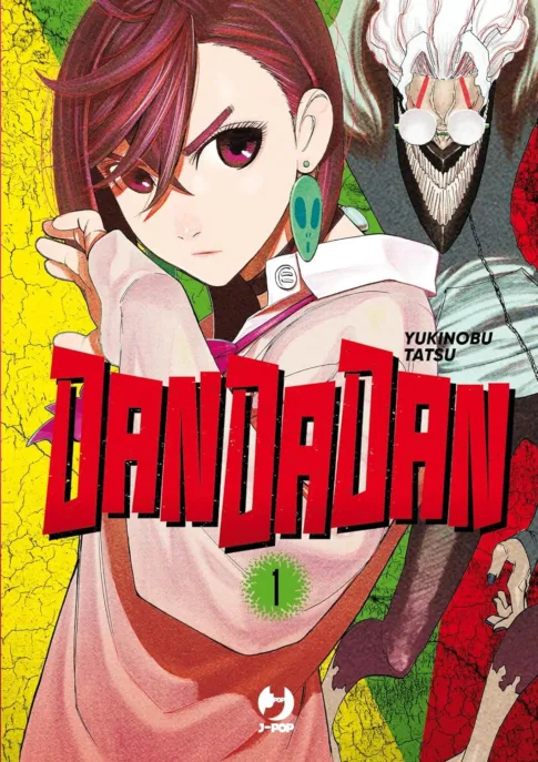 Copertina del manga "DanDaDan" di Yukinobu Tatsu, con una ragazza sicura di sé con i capelli corti e un grande personaggio mascherato sullo sfondo. Il titolo è ben visibile in grassetto rosso. Questa recensione racchiude perfettamente l'emozionante essenza del lavoro di Yukinobu Tatsu.